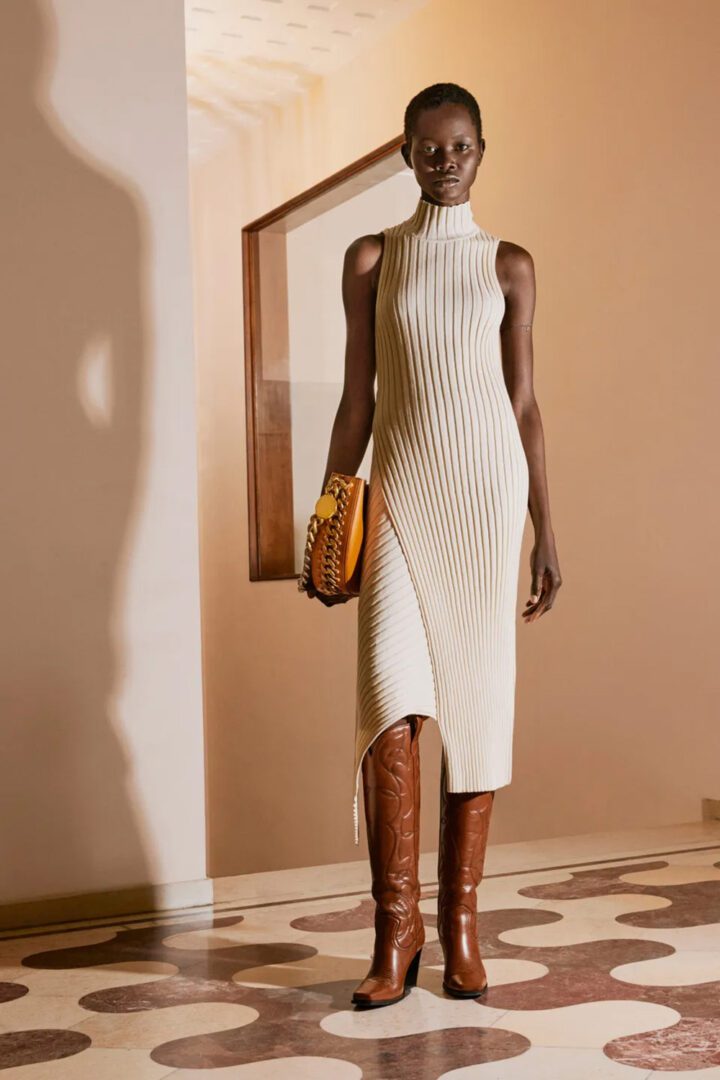 Stella McCartney Pre Fall 2022 Collection I Cream Ribbed Knit Midi Dress and Brown faux leather cowboy boots #fashionstyle #ootdstyle