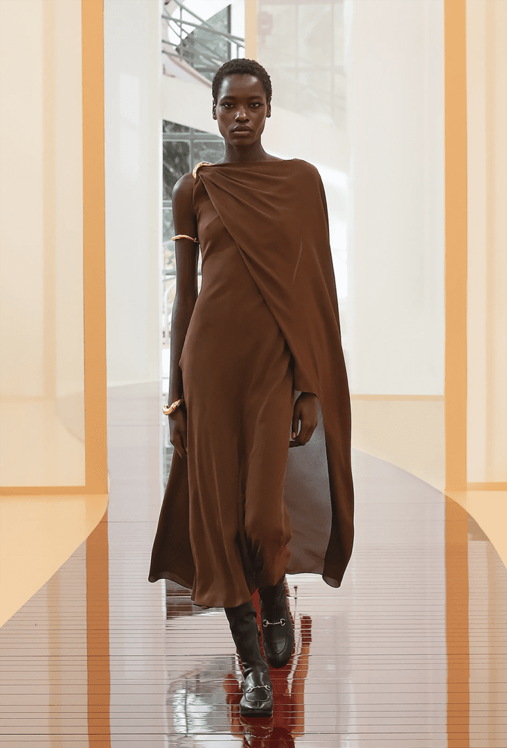 Best MFW Spring 2025 Looks off the Runway I Gucci rich brown midi dress with cape