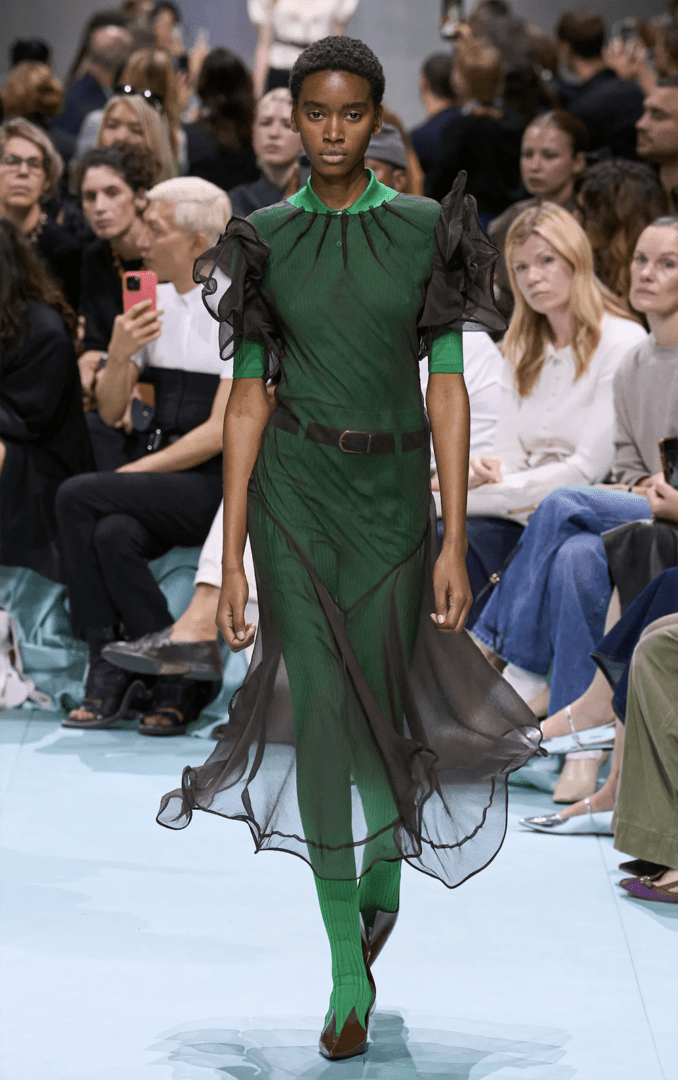 Best MFW Spring 2025 Looks Off Runway I Green Prada with sheer black organza dress